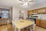 Full kitchen and access to the back deck for grilling & outdoor dining